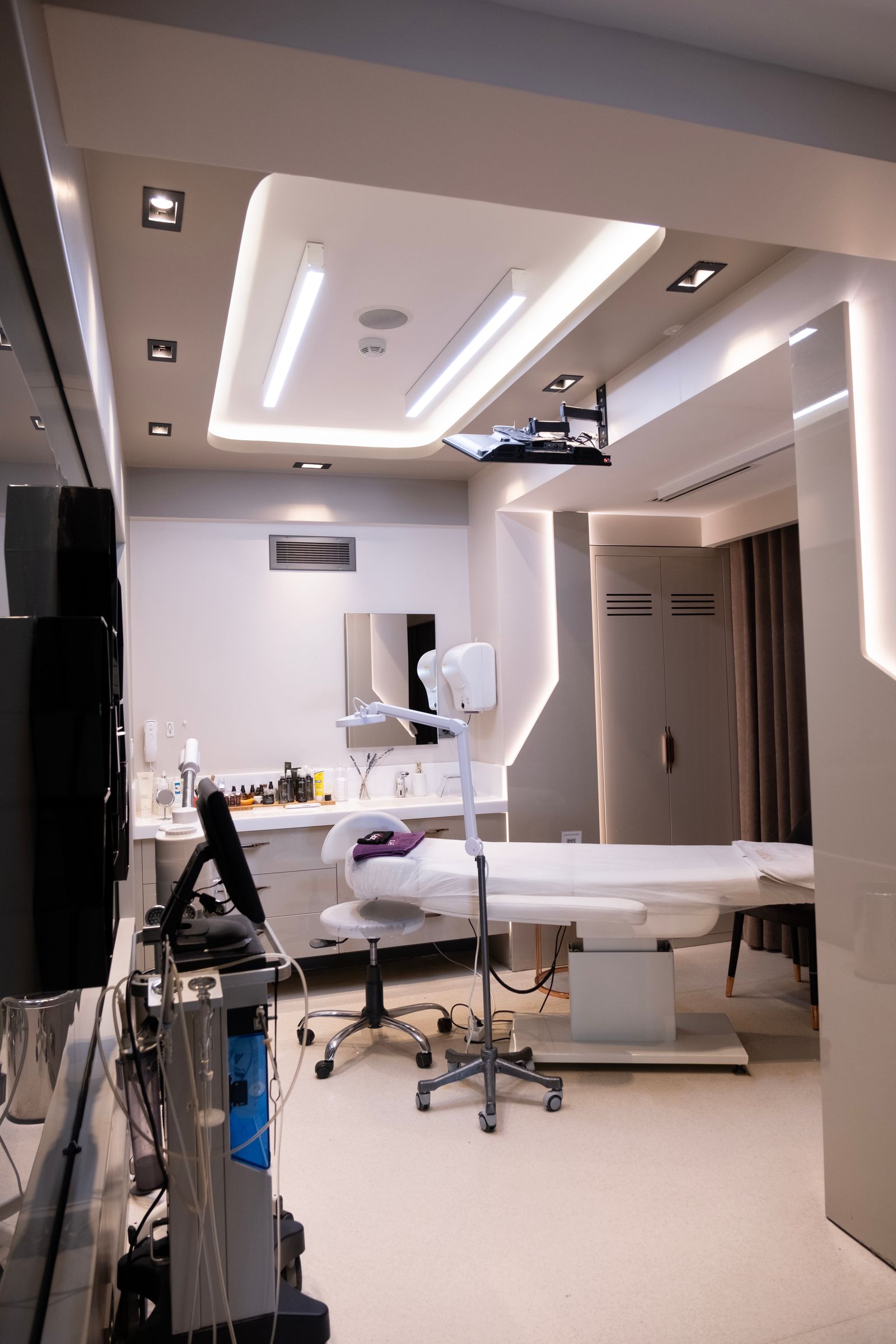 A sleek contemporary treatment room in an aesthetic clinic